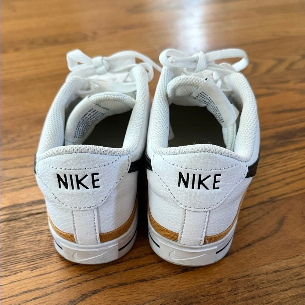 Nike Court Legacy White Low-Top Sneakers with Black Swoosh and Gold Accent